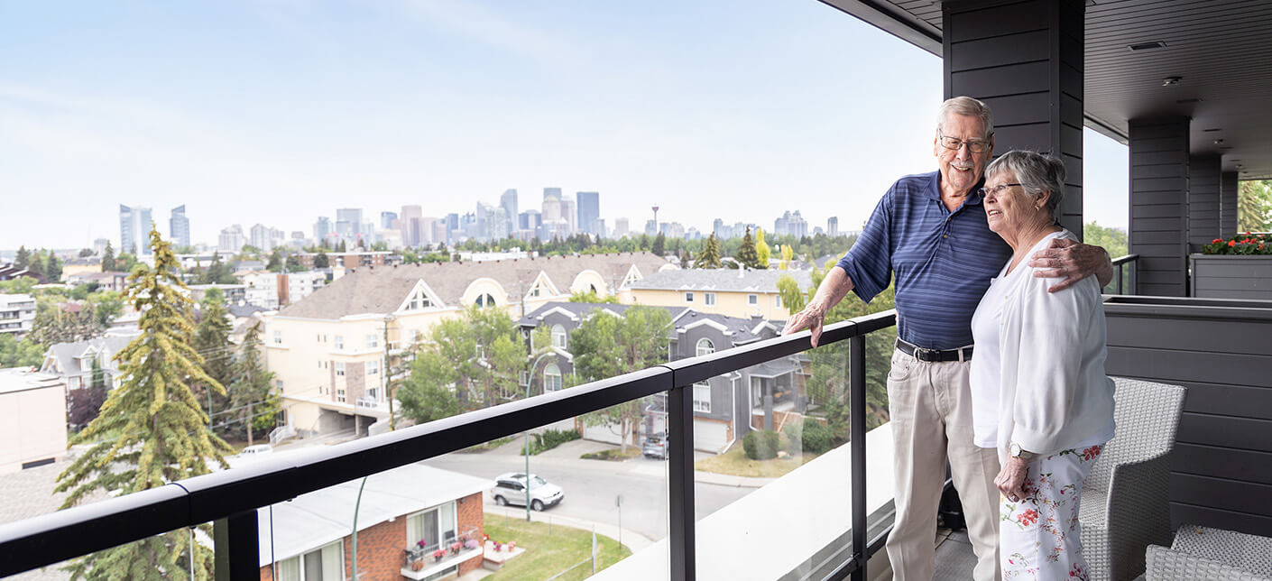 Senior couple standing on balcony